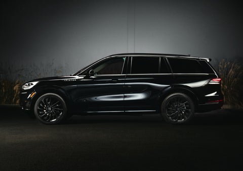 A 2024 Lincoln Aviator® SUV is shown in the Infinite Black exterior color | Doral Lincoln in Doral FL