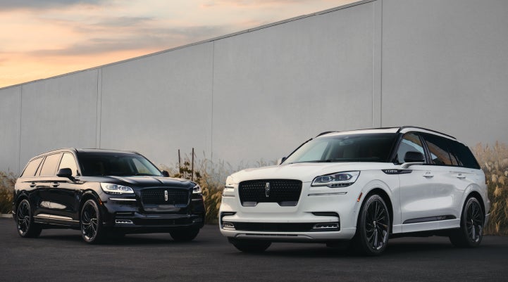 Two Lincoln Aviator® SUVs are shown with the available Jet Appearance Package | Doral Lincoln in Doral FL