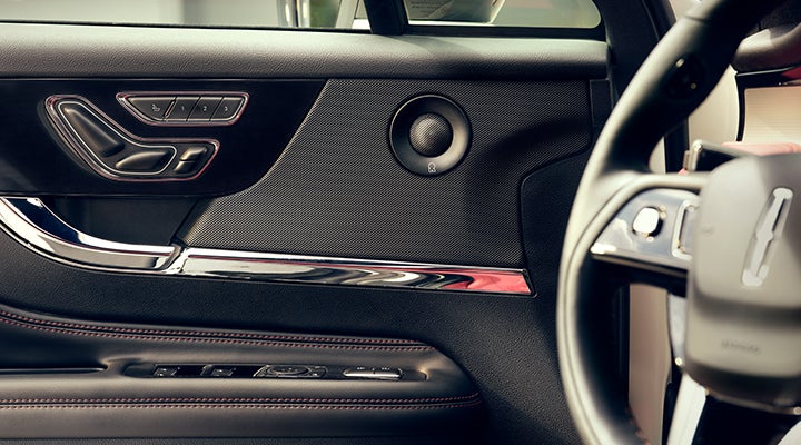 A Revel® audio speaker is shown in the driver’s side door of a 2024 Lincoln Corsair® SUV. | Doral Lincoln in Doral FL