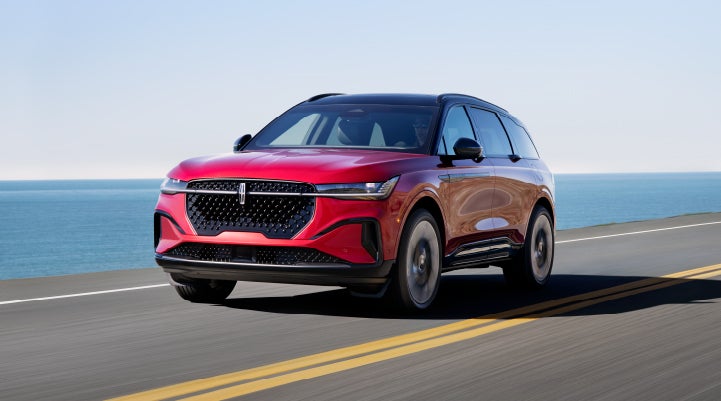 A 2024 Lincoln Nautilus® SUV is being driven on a seaside roadway. | Doral Lincoln in Doral FL