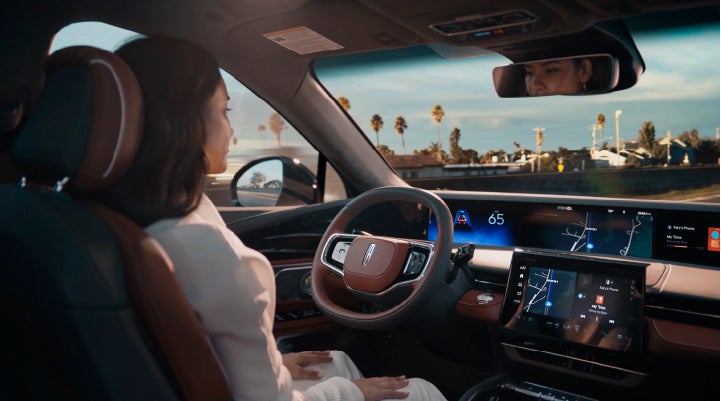 A person is shown driving hands-free on the highway with available Lincoln BlueCruise technology. | Doral Lincoln in Doral FL