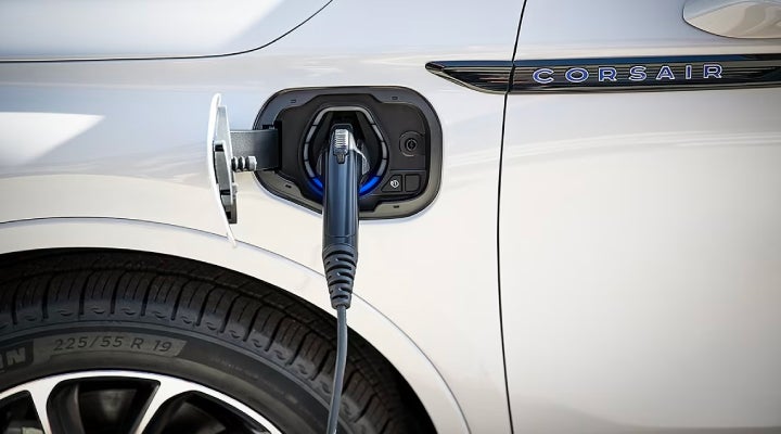 An electric charger is shown plugged into the charging port of a Lincoln Corsair® Grand Touring
model. | Doral Lincoln in Doral FL