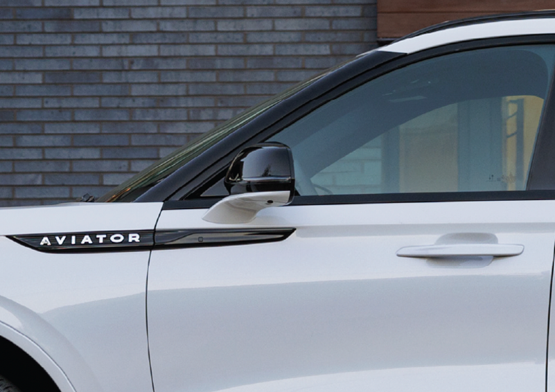 The driver’s door of a white 2025 Lincoln Aviator® SUV is showcased. | Doral Lincoln in Doral FL